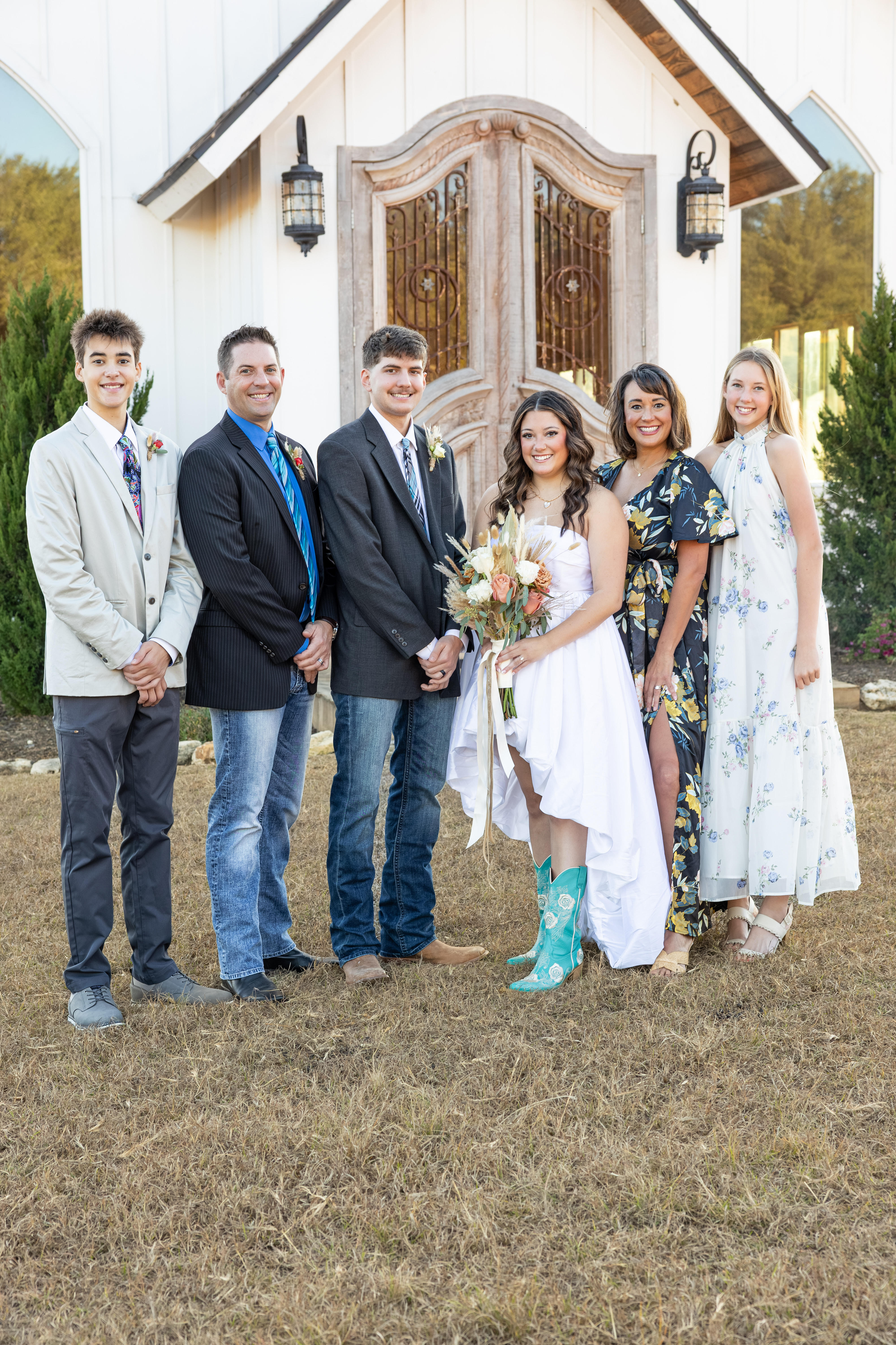 Alison Keber with her family outside a white chapel
